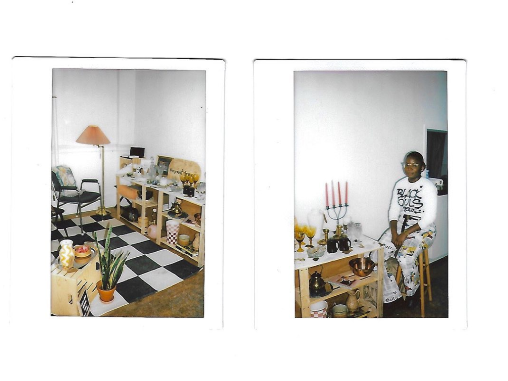 Polaroid picture to the left of a brown shelf, black chair, pink lamp, snake planet, and a black and white checkered rug. Polaroid picture to the right is Vanessa, a Black women, sitting on a stool beside a brown shelf with candles, glasses, and bowls.